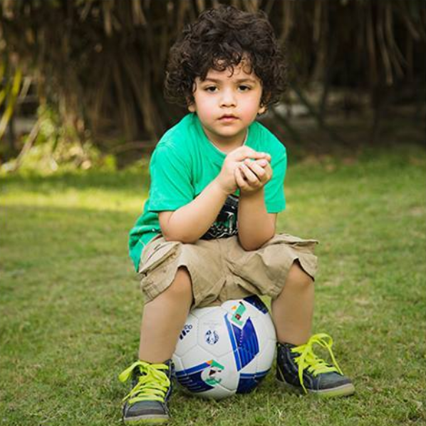 Green Shirt Blue Shorts